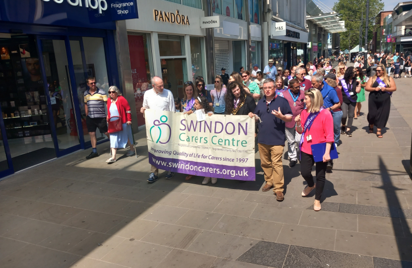 Sir Robert Buckland KBE KC MP Taking part in the Swindon Carers Walk a Mile Event as part of Carers Week 2023