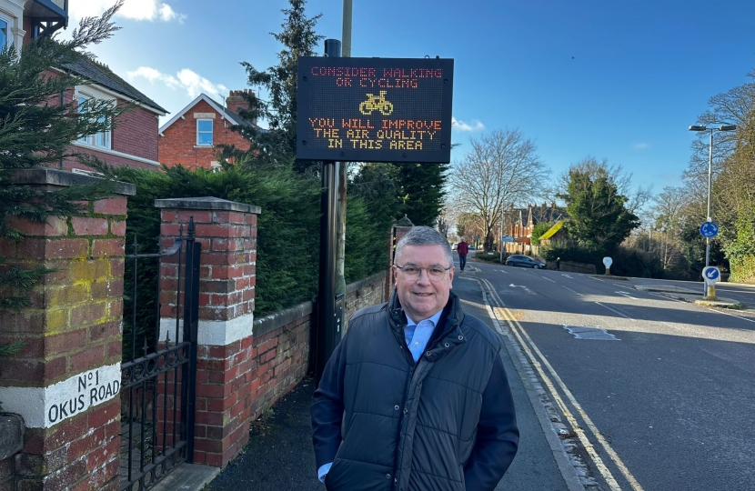 The Rt Hon Sir Robert Buckland MP next to the brand new government funded digital signs