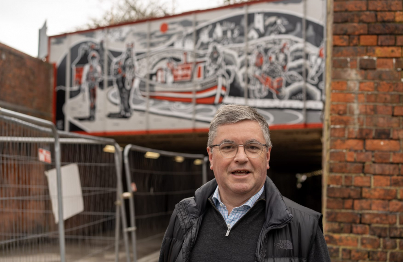 Sir Robert Buckland MP with the new Conservative Government Funded  mural showcasing Swindon’s canal history 