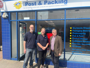 Sir Robert Buckland Photographed with Shani and Darren at the new Post and Packaging Store in Swindon Town Centre